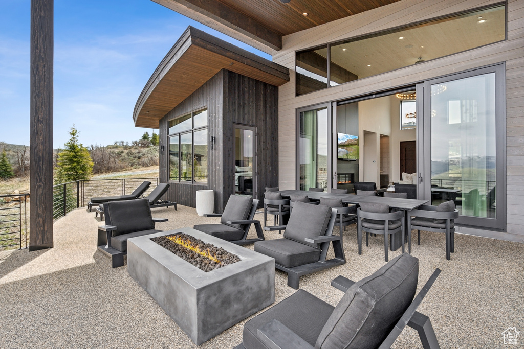 View of patio / terrace with outdoor dining space and a fire pit