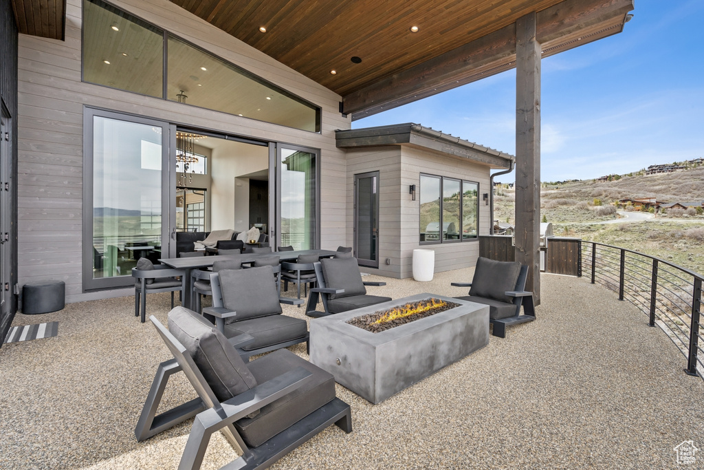 View of patio / terrace with an outdoor fire pit