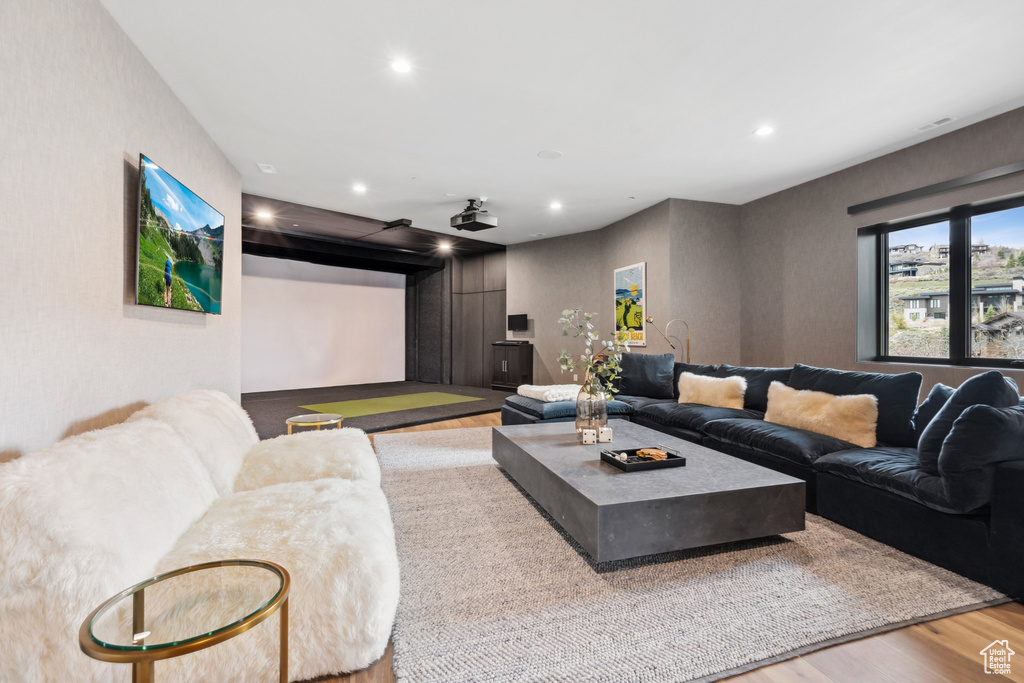 Living area featuring wood finished floors and recessed lighting
