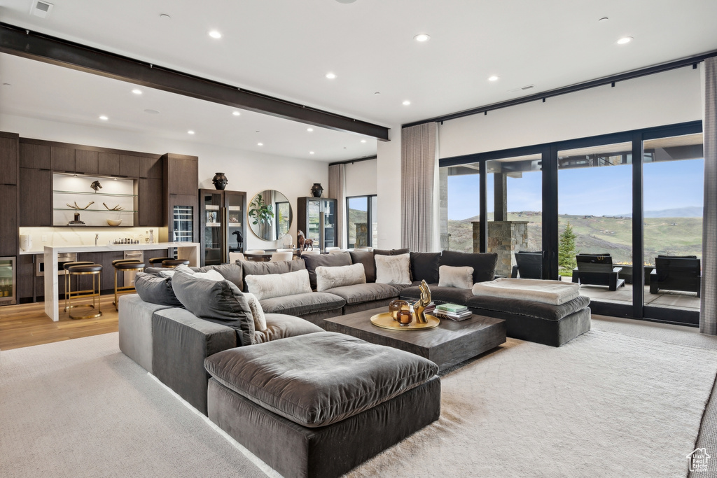 Living room featuring recessed lighting and bar