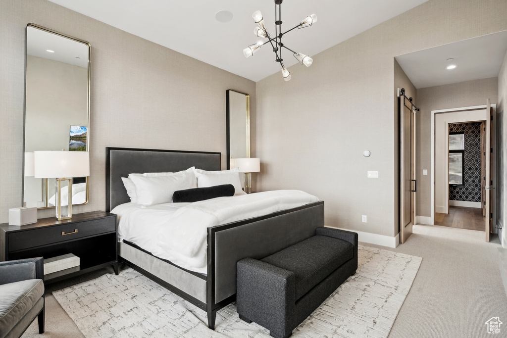 Bedroom with lofted ceiling, light carpet, a chandelier, and baseboards
