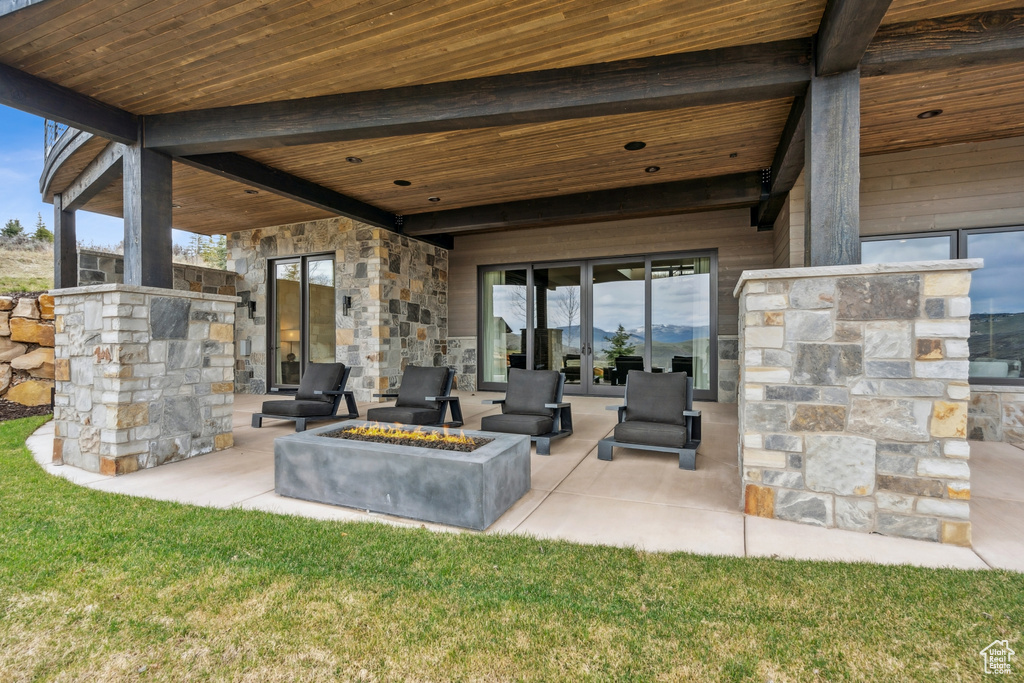 View of patio featuring a fire pit