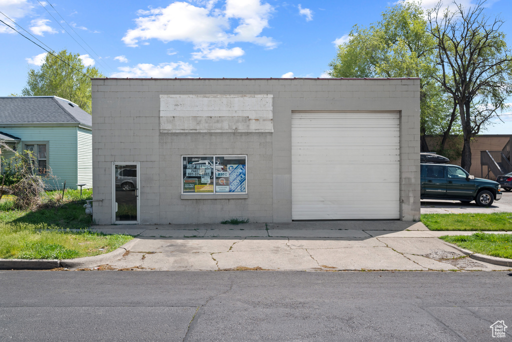 Exterior space featuring concrete driveway