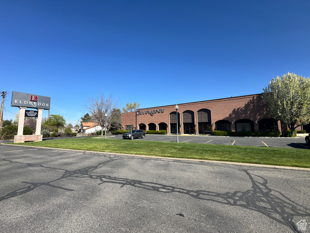 View of property with uncovered parking