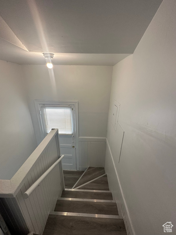 Staircase with a wainscoted wall