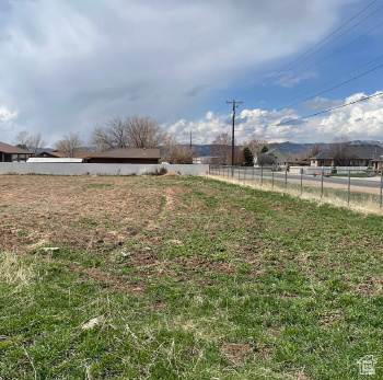 View of yard featuring fence