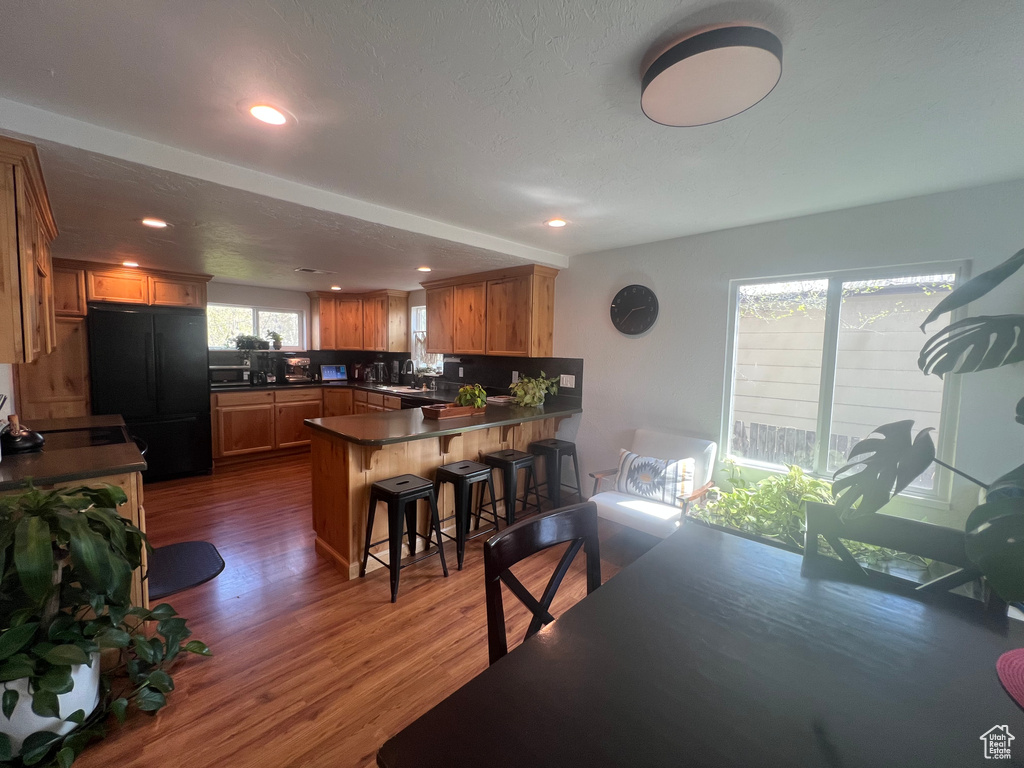 Dining space featuring recessed lighting and dark wood-style floors
