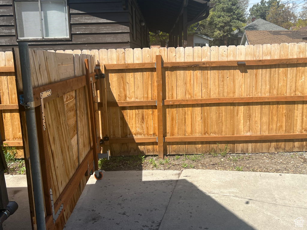 View of patio with fence