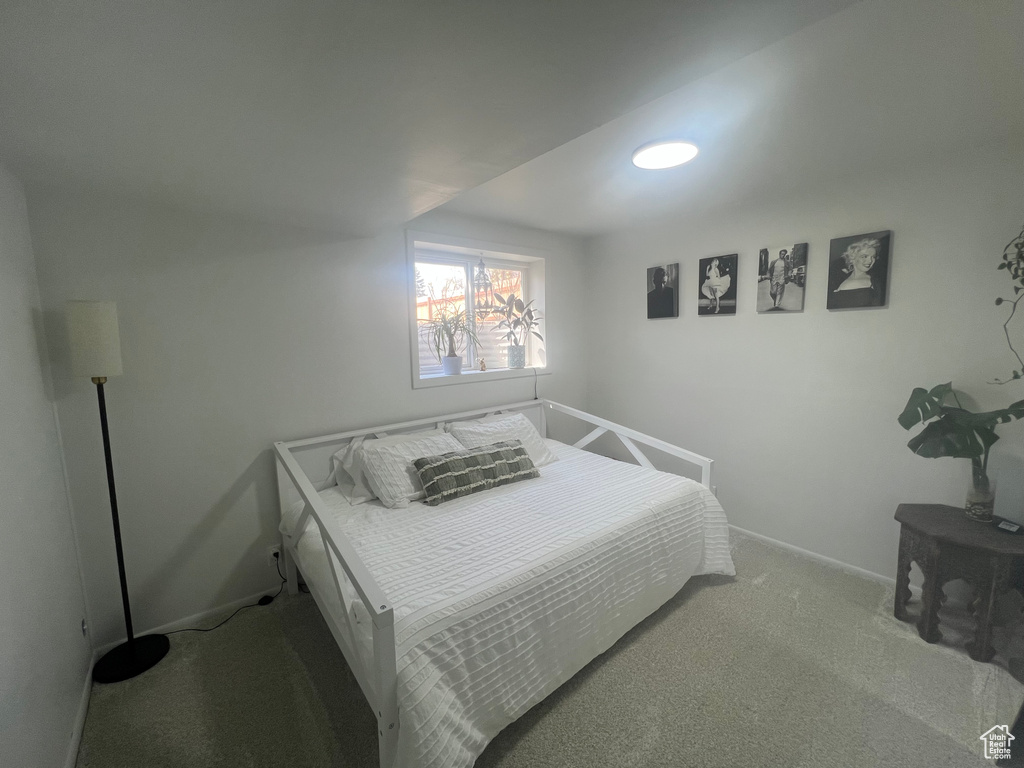 Carpeted bedroom with baseboards