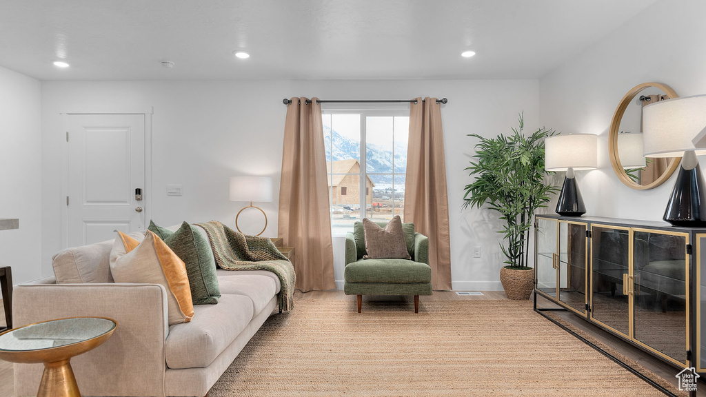 Living room with baseboards and recessed lighting