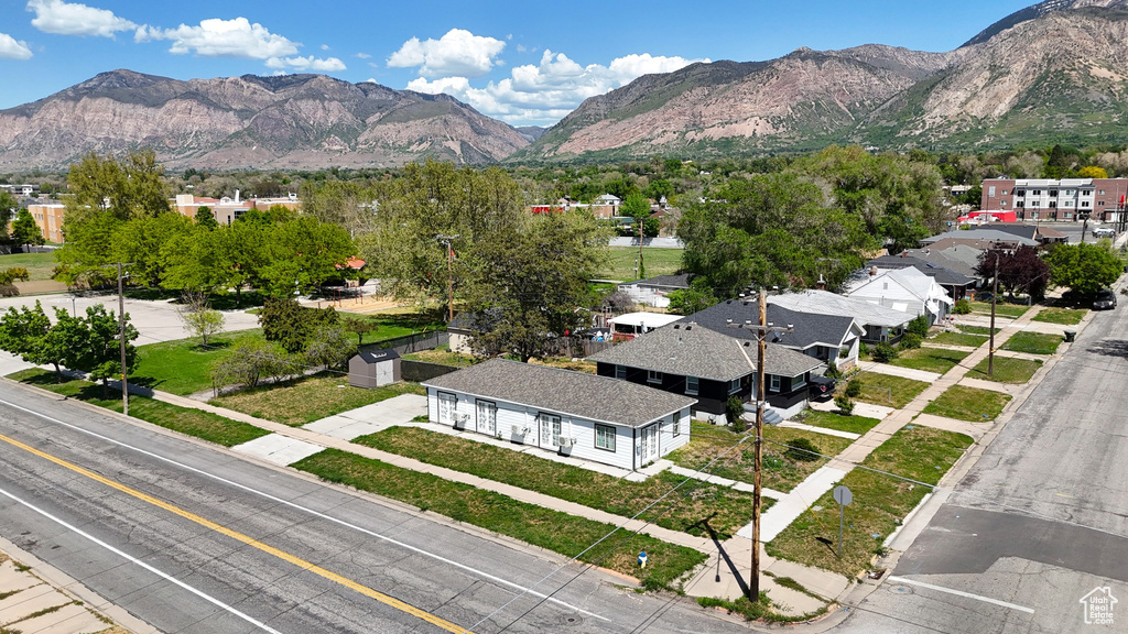 Aerial perspective of suburban area featuring a mountainous background