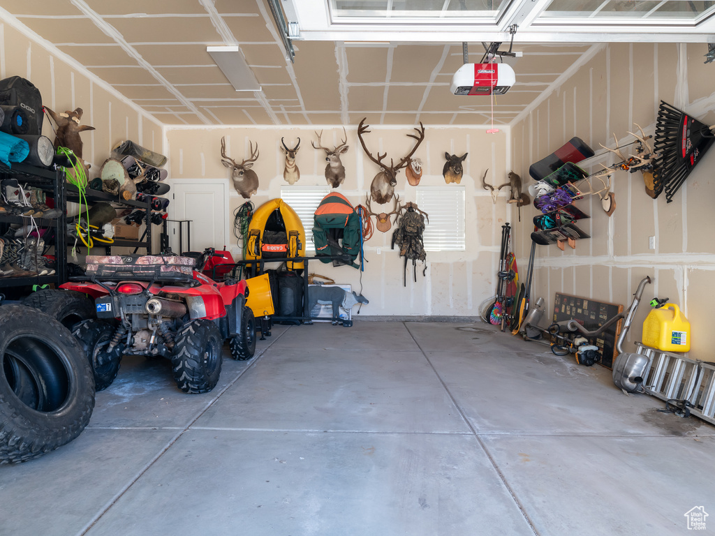 Garage featuring a garage door opener