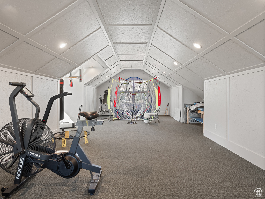 Exercise area with recessed lighting, carpet, and vaulted ceiling
