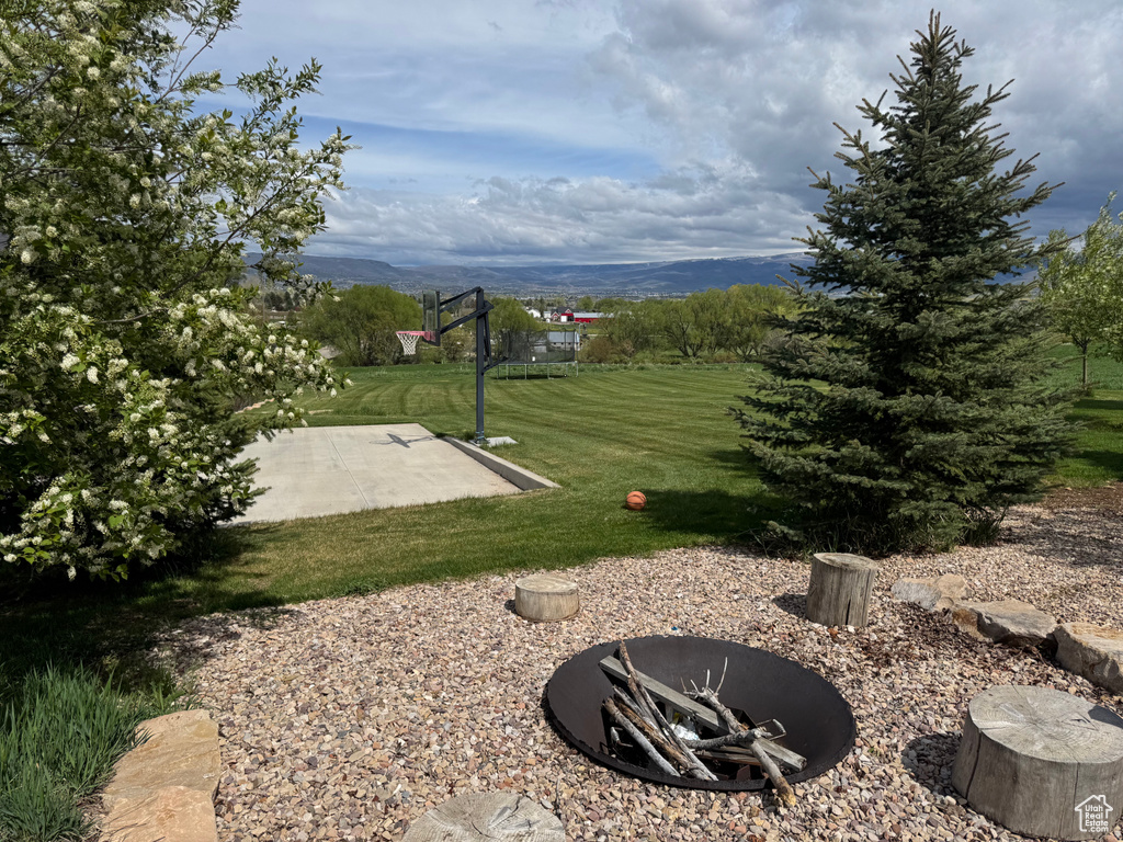 View of green lawn with a mountain view