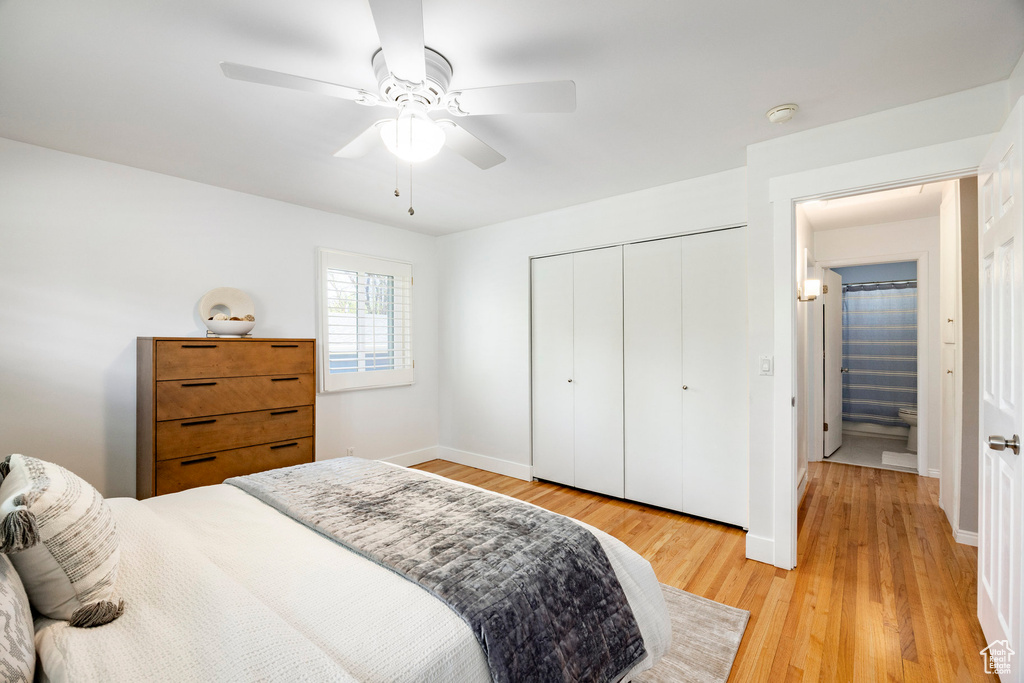 Bedroom featuring light wood finished floors, a closet, a ceiling fan, and baseboards