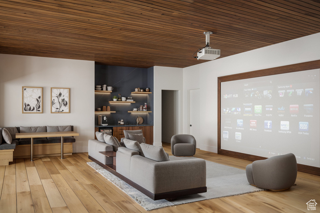Home theater featuring wooden ceiling and light wood-style floors