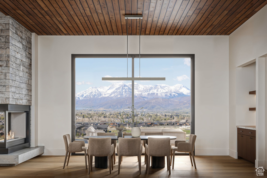 Dining space featuring a mountain view and wood finished floors
