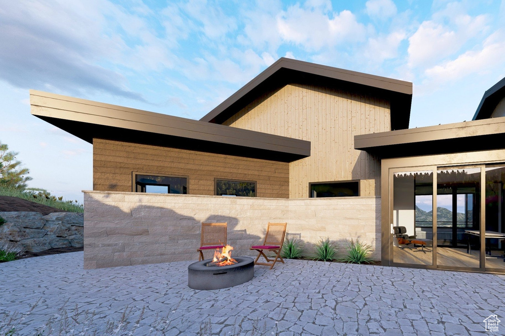 View of patio / terrace with an outdoor fire pit
