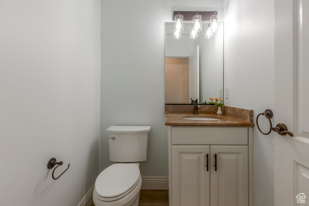 Half bath with toilet and vanity