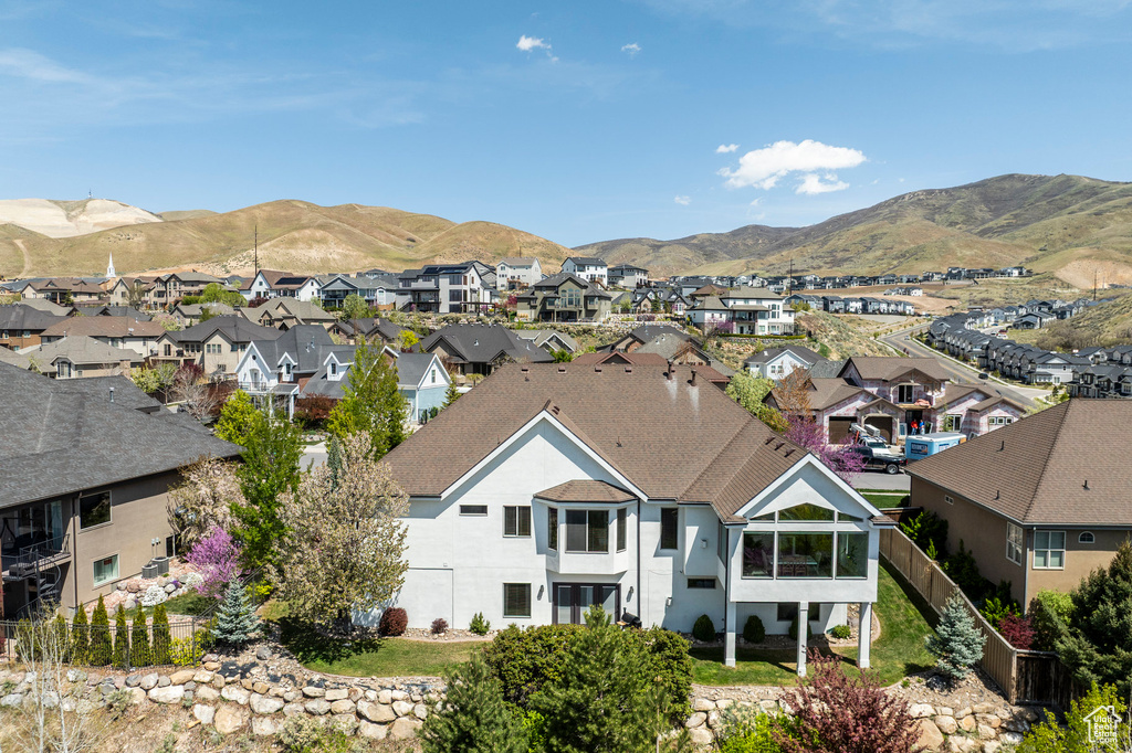 Birds eye view of property featuring a mountain view and a residential view