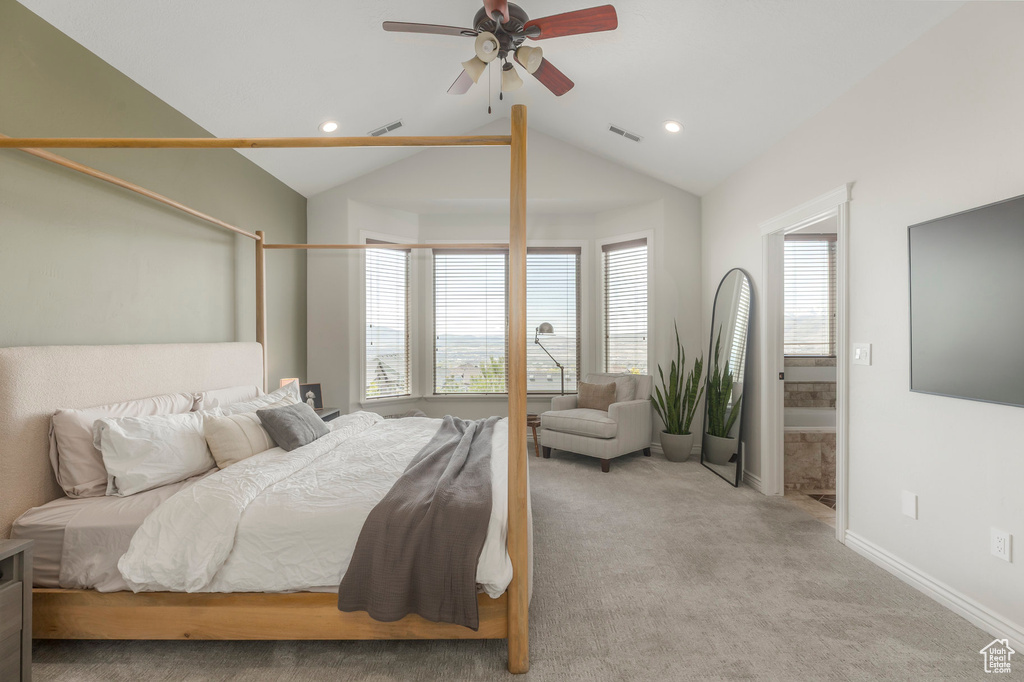 Bedroom with recessed lighting, visible vents, vaulted ceiling, light carpet, and baseboards
