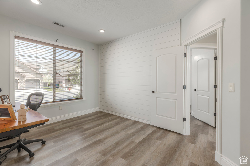 Office with baseboards, recessed lighting, visible vents, and light wood-style flooring