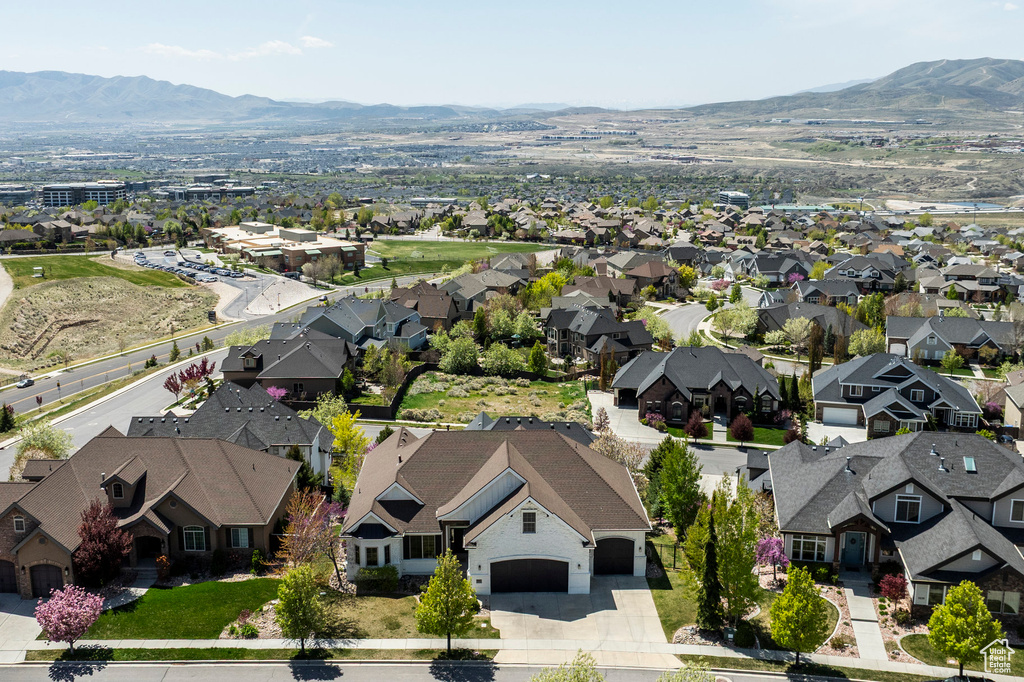 Birds eye view of property with a residential view and a mountain view