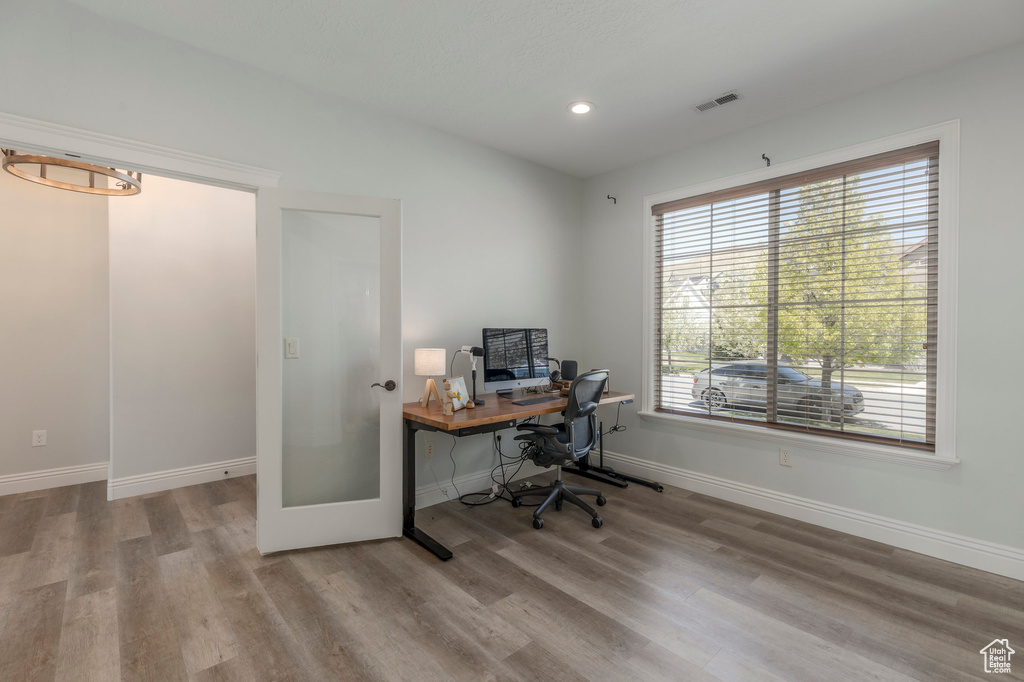 Office with recessed lighting, visible vents, wood finished floors, and baseboards