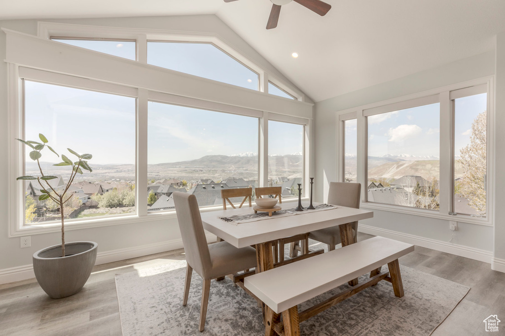 Sunroom / solarium featuring a mountain view