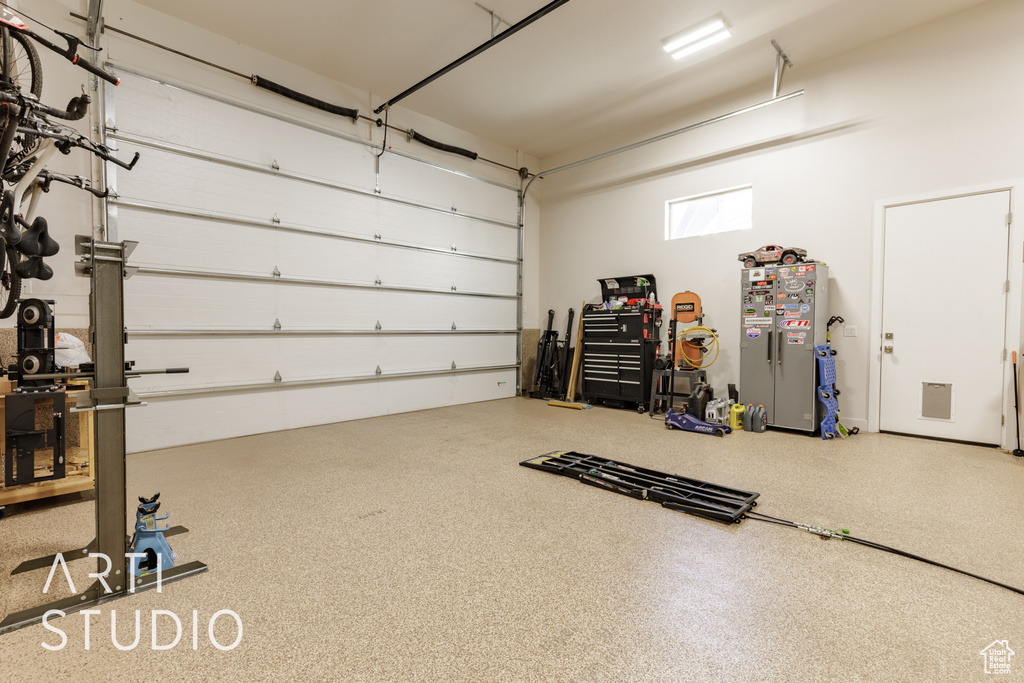 Garage with freestanding refrigerator