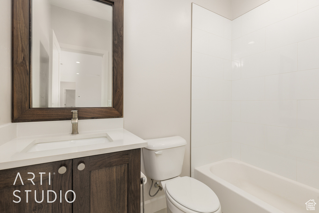 Full bath featuring vanity and toilet