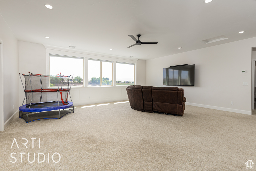 Living area with a ceiling fan, carpet flooring, recessed lighting, and baseboards