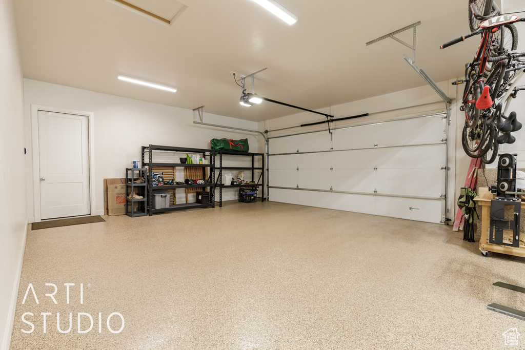 Garage featuring a garage door opener