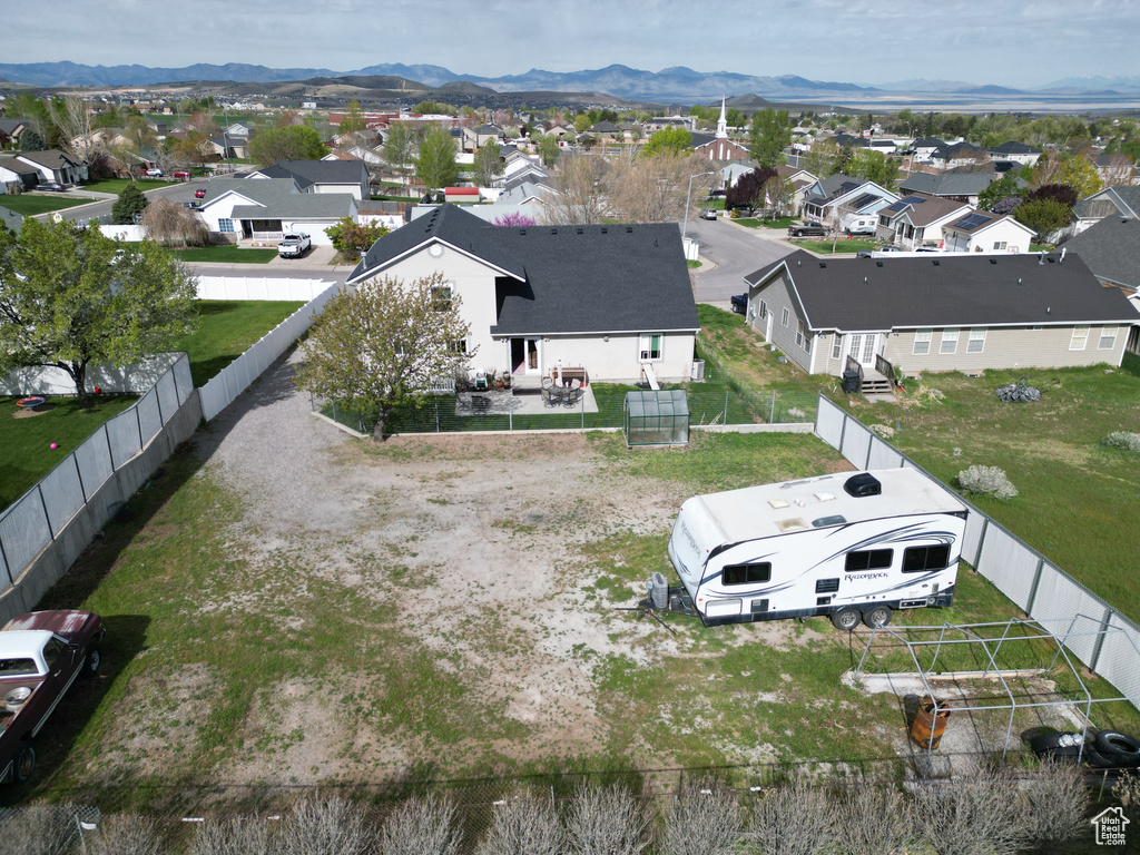 Birds eye view of property featuring a residential view and a mountain view