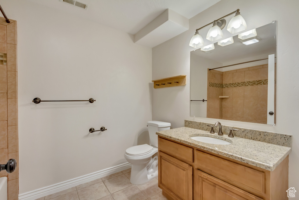 Full bathroom featuring a shower, visible vents, toilet, and tile patterned flooring