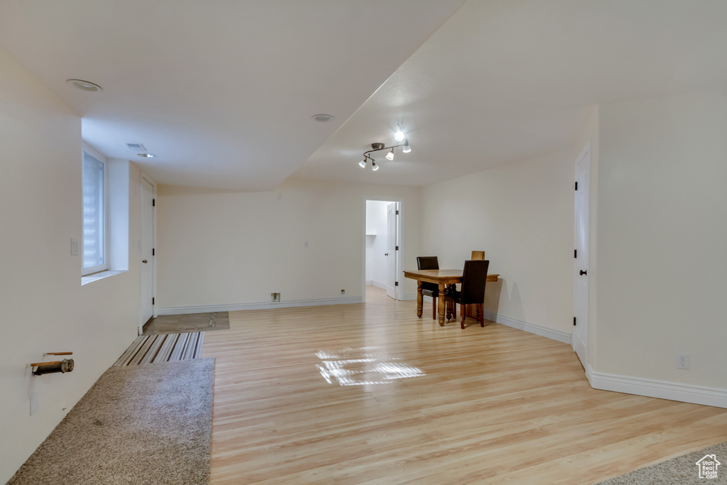Interior space featuring light wood-style flooring and baseboards