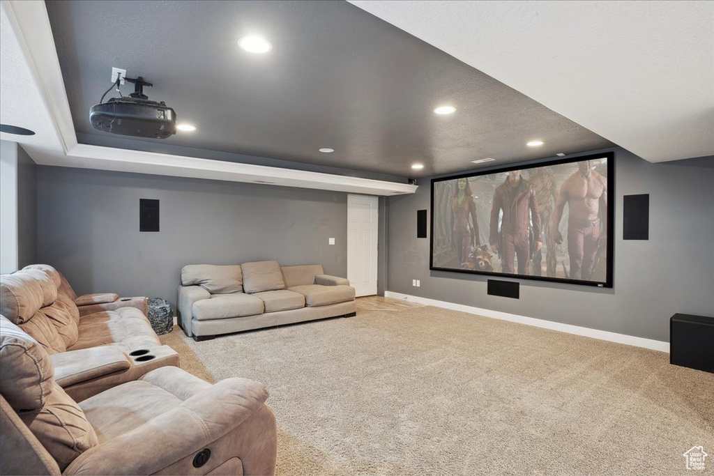 Home theater room with recessed lighting, carpet flooring, and baseboards