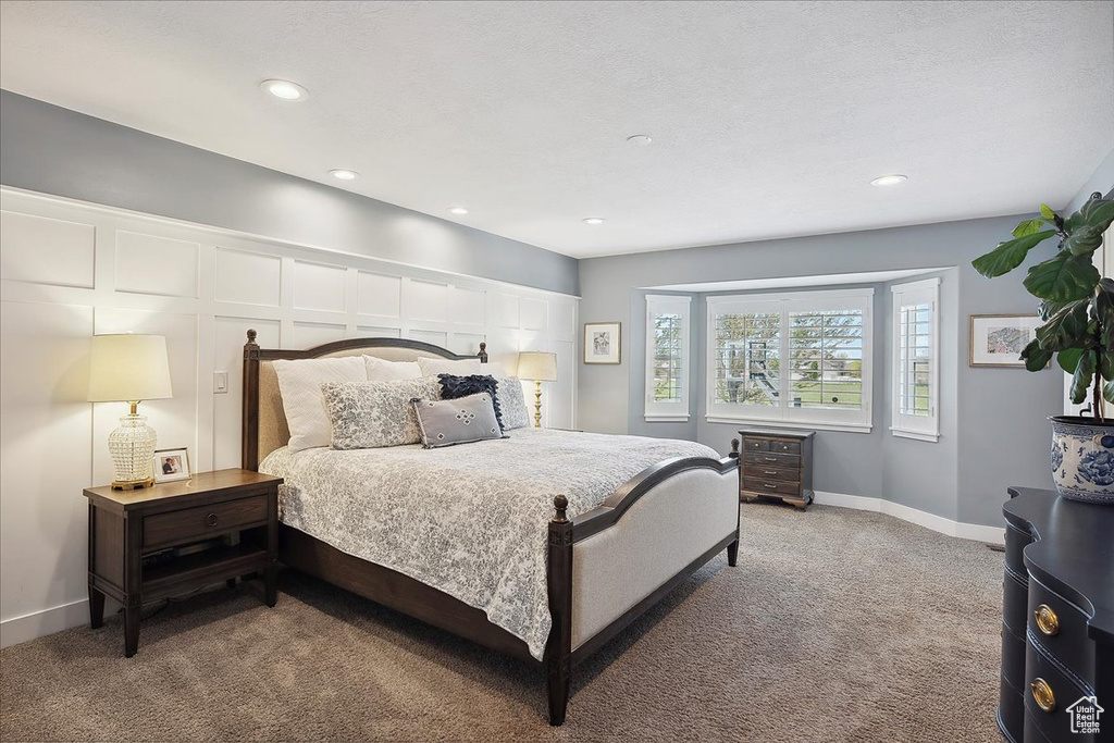 Bedroom featuring recessed lighting, baseboards, and carpet floors