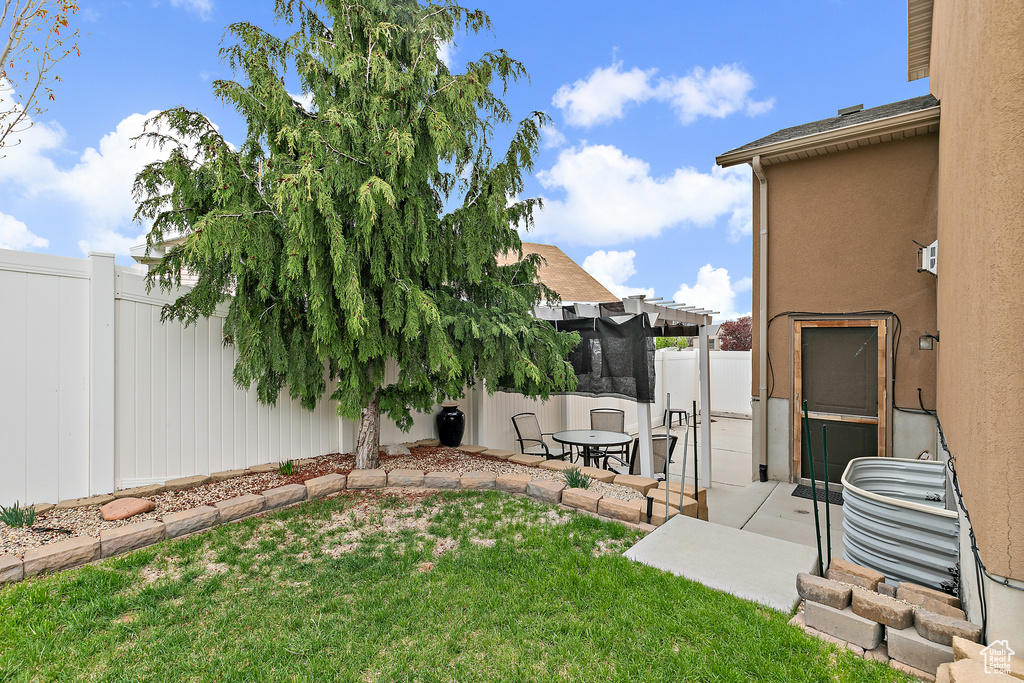 View of yard with a patio and a fenced backyard