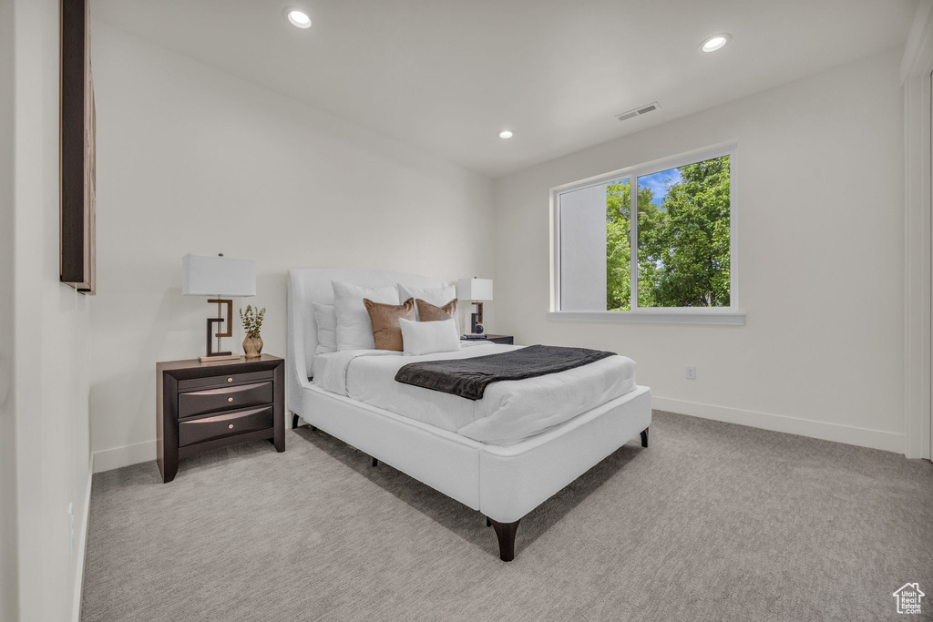 Bedroom featuring recessed lighting, baseboards, visible vents, and carpet