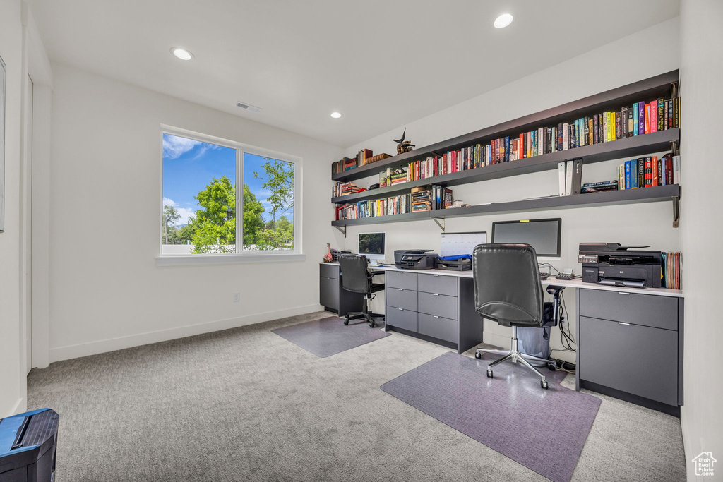 Office area with baseboards, recessed lighting, visible vents, and light carpet