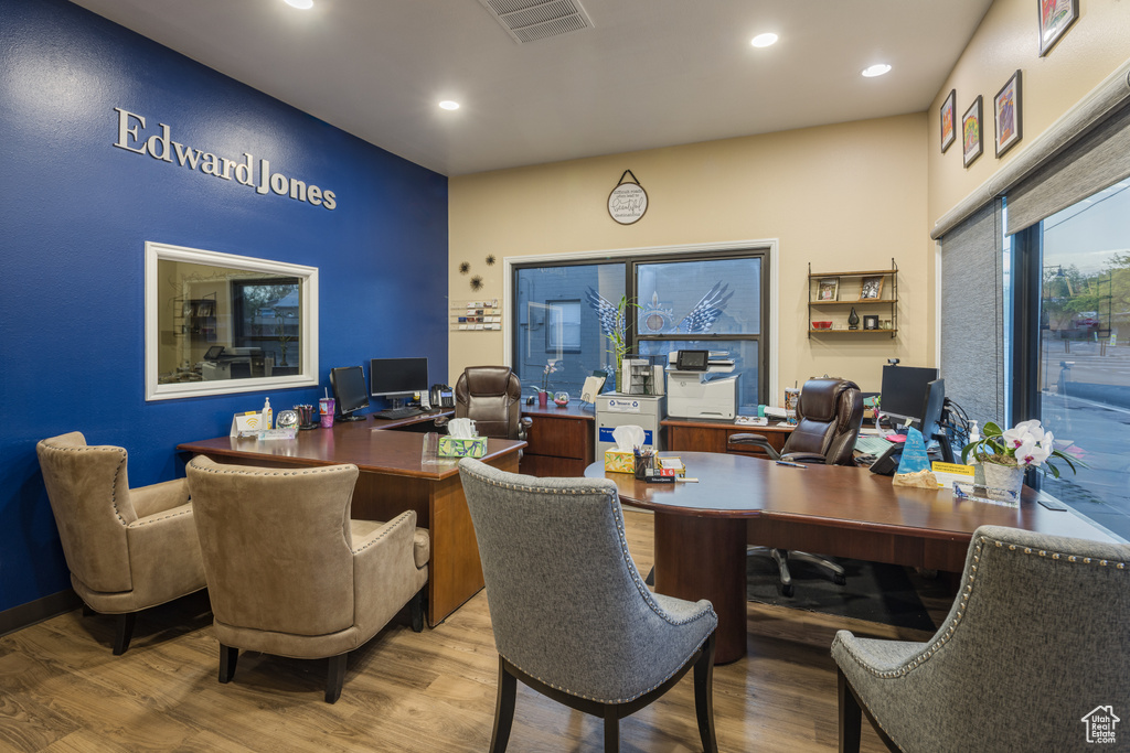 Office space featuring wood finished floors, visible vents, and recessed lighting