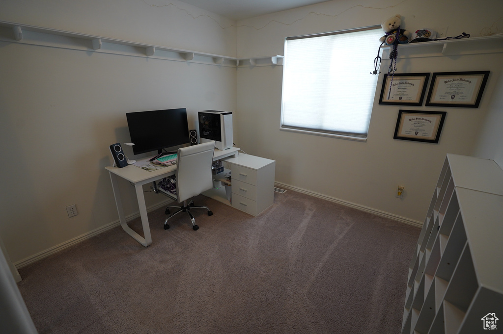Office with baseboards and carpet floors