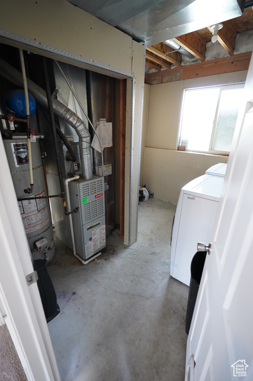Below grade area with water heater and independent washer and dryer