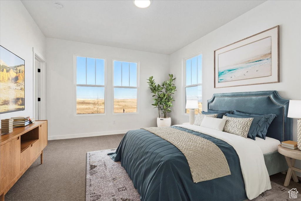 Bedroom with baseboards and carpet flooring