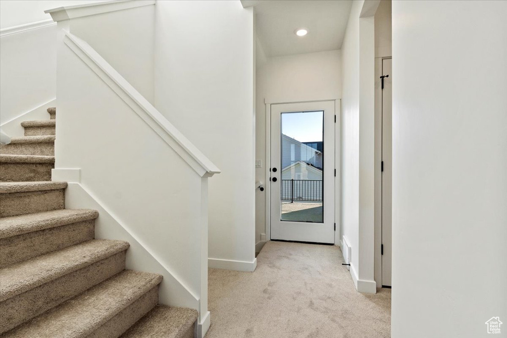 Stairs with recessed lighting, carpet flooring, and baseboards