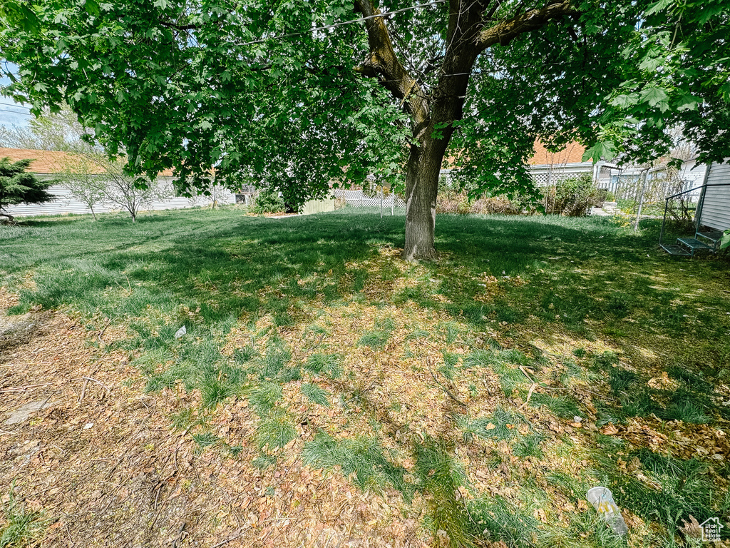 View of yard featuring fence