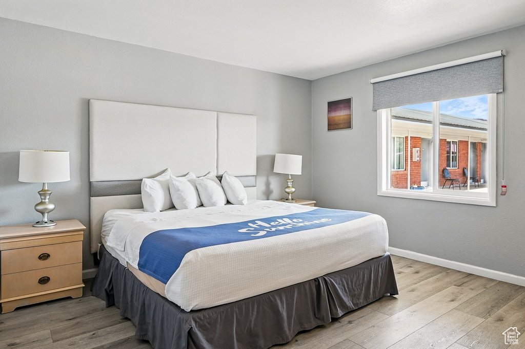 Bedroom featuring light wood-type flooring and baseboards