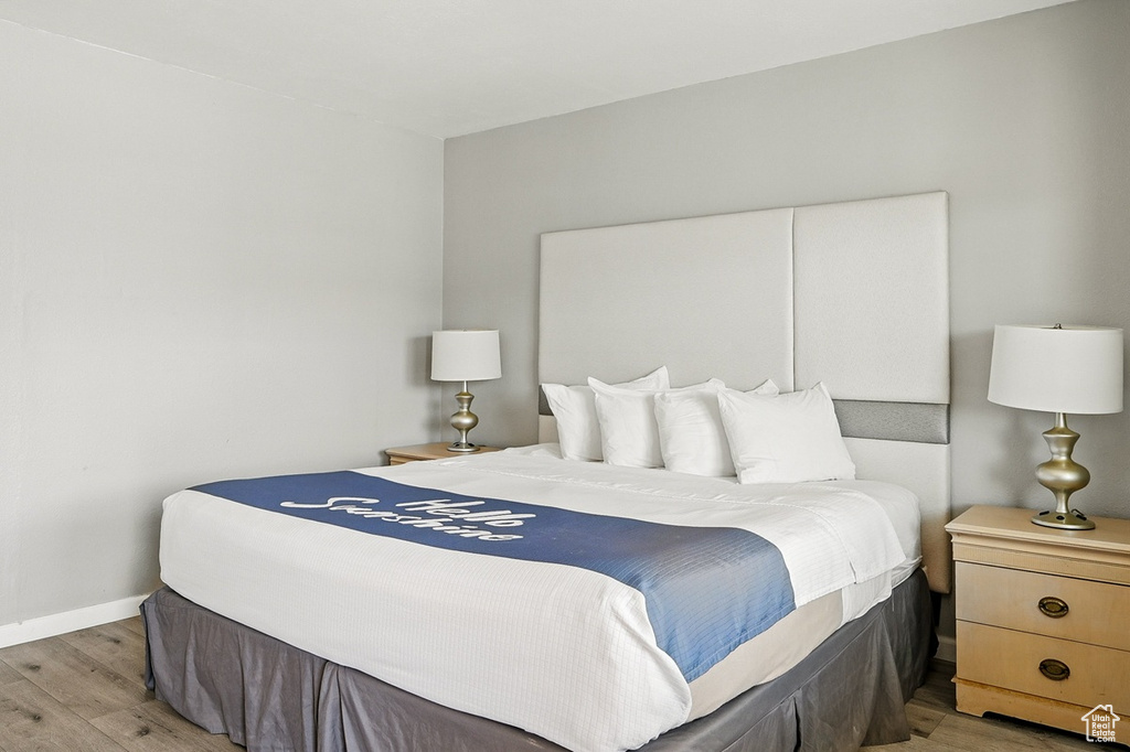 Bedroom featuring baseboards and light wood-style floors