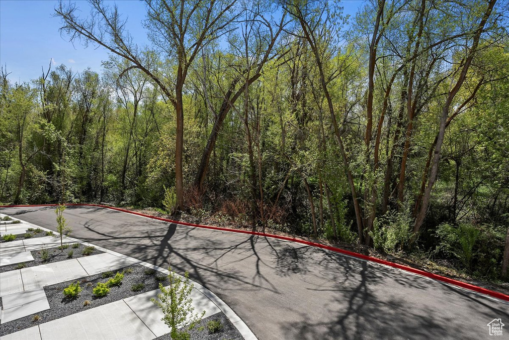 Exterior space with a wooded view